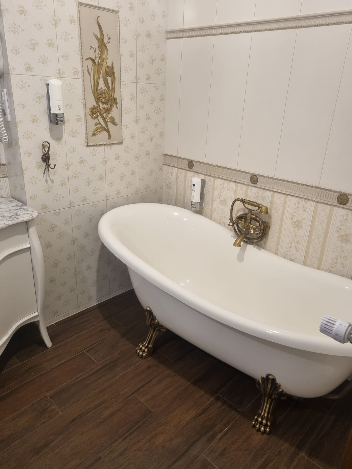 Freestanding clawfoot bath with traditional brass fittings — recent project